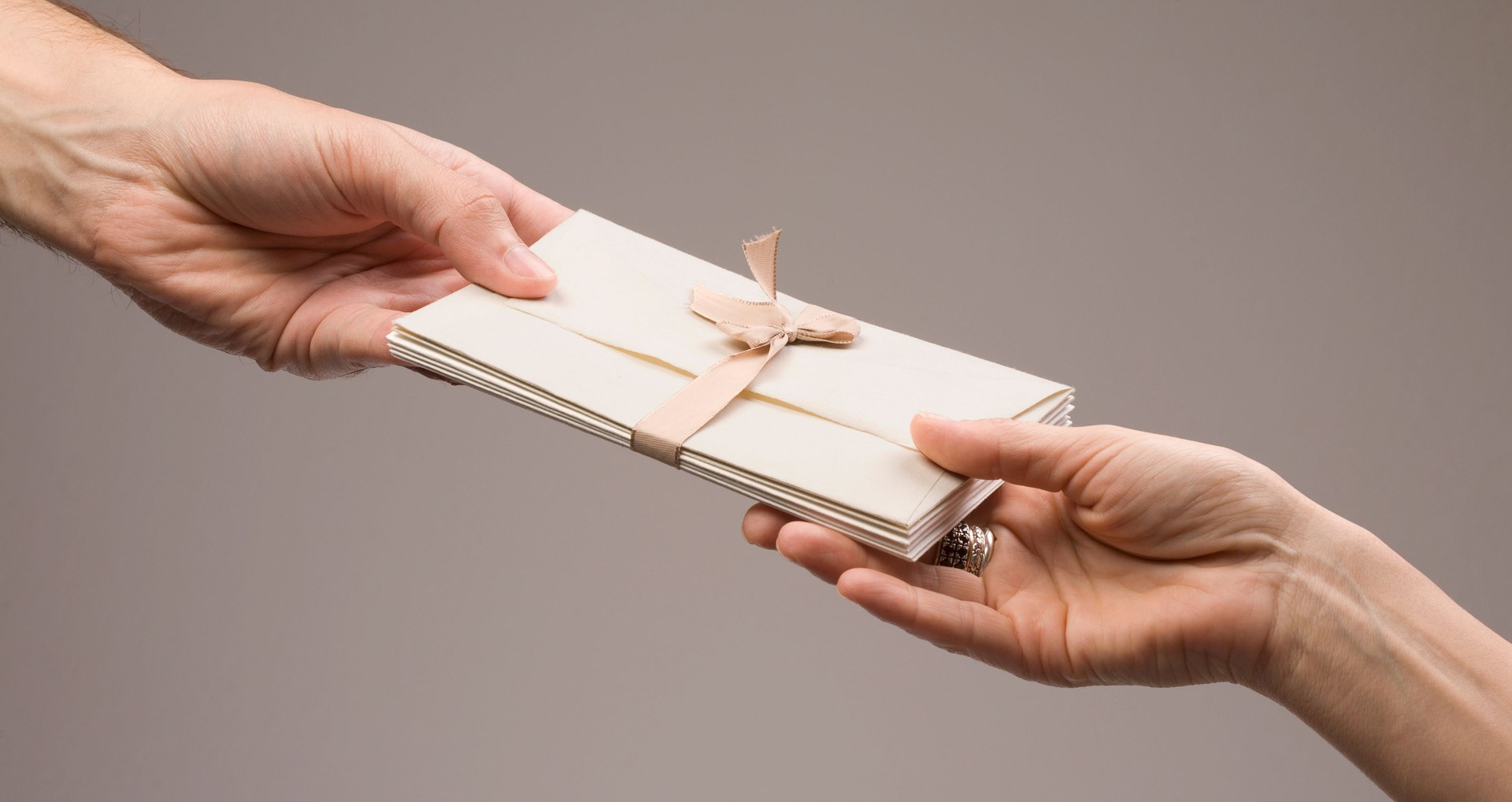 Hands with envelopes